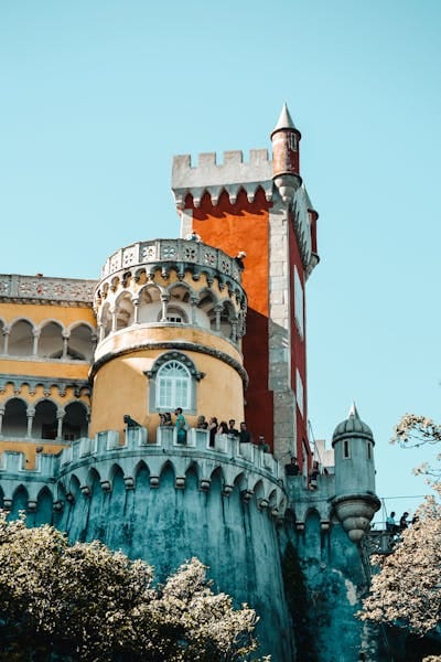 Explore the vibrant architecture of Pena Palace in Sintra, a UNESCO World Heritage Site.