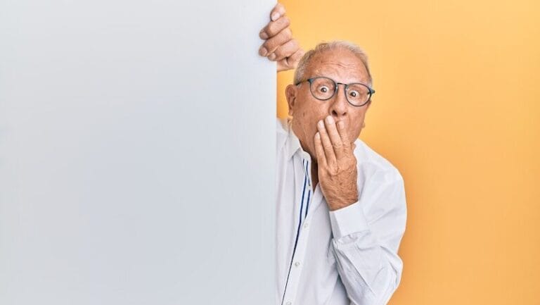 man in white dress shirt wearing black framed eyeglasses