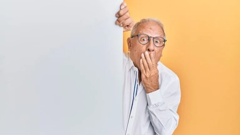 man in white dress shirt wearing black framed eyeglasses
